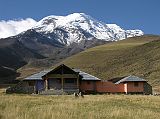 Ecuador Chimborazo 01-02 Estrella del Chimborazo Main Building In The Afternoon With Chimborazo Behind Perfectly situated at the foot of Chimborazo is the mountain lodge 